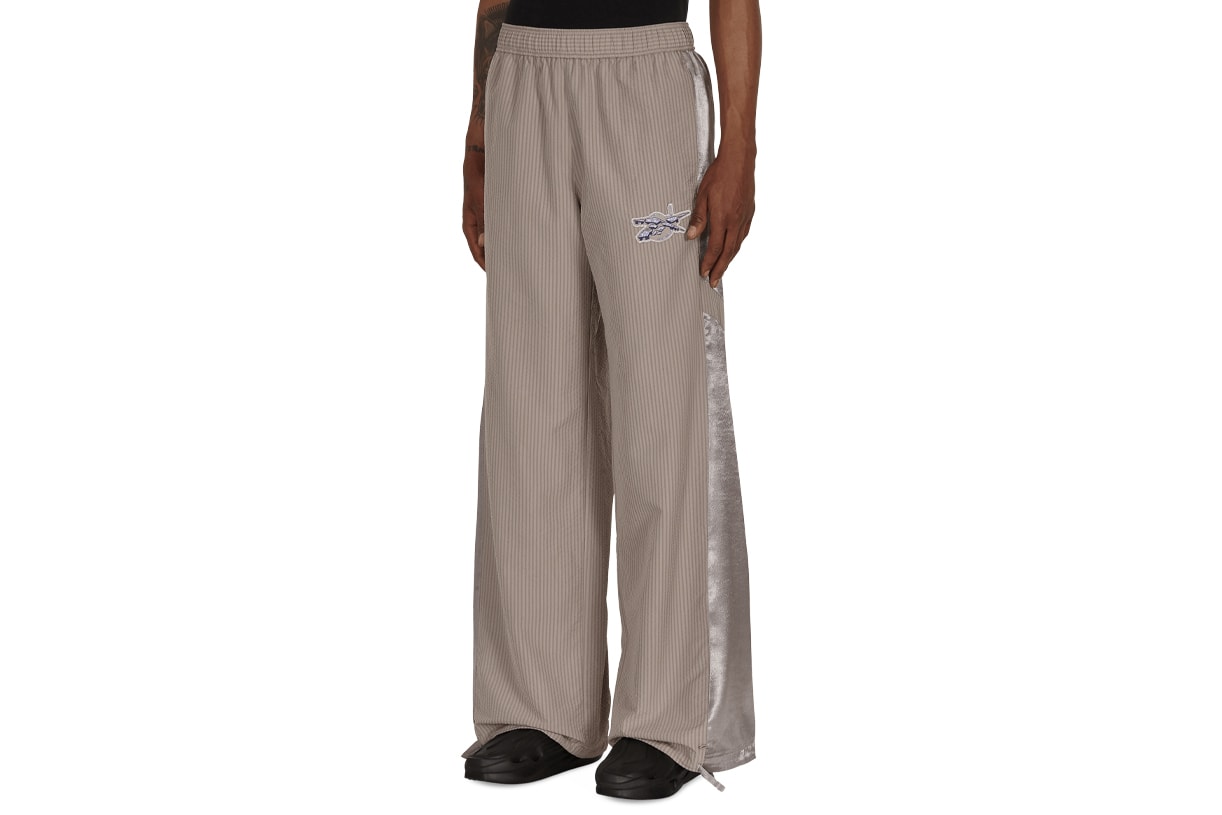 Best Trousers Summer 2021 What to Wear Hot Weather Breezy Wide Leg Floaty Bottoms Pants Bell Bottom Our Legacy Homme Plisse Issey Miyake Designer High Street COS Eckhaus Latta Stone Island Nedews Independent London Brands Acne Studios Eye LOEWE Nature Uniqlo Nike ACG Cottweiler Reebok Luca Magliano