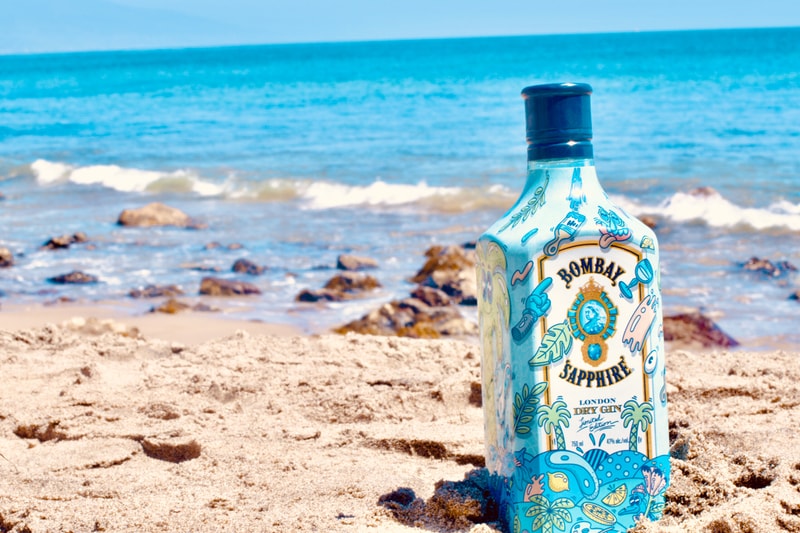 Bombay artist collaboration shoppable lookbook closer look well-infused glass of flavors 10 hand-selected botanicals from exotic locations around the world tongue-in-cheek, inviting graphics and colorful pop latest custom limited-edition lemon peel, almonds for the almond powder and juniper berries playful, vibrant graphics flavor fun Steven Harrington x Bombay Sapphire bottle collaboration $22.99 USD