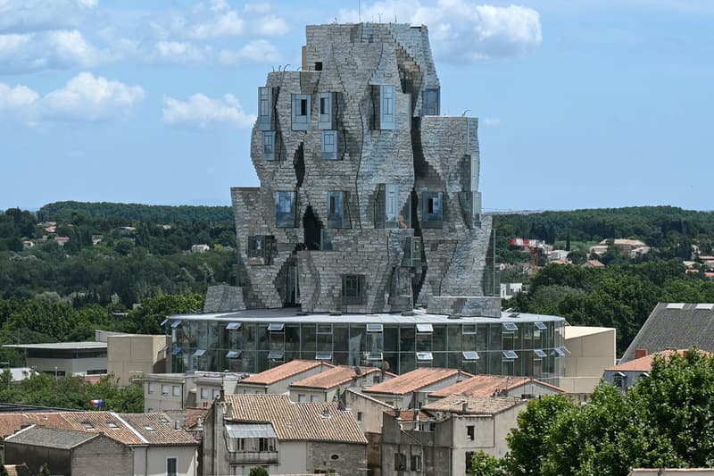 Frank Gehry Unveils Reflective Stainless Steel-Clad Tower in Southern France LUMA Arles france parc des ateliers paris van goh starry night roman amphitheater aluminum france roman arles south of france