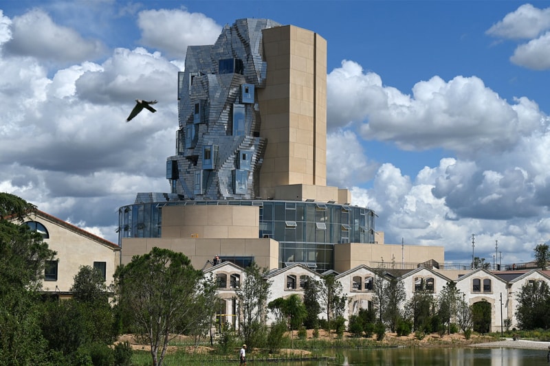 Frank Gehry Unveils Reflective Stainless Steel-Clad Tower in Southern France LUMA Arles france parc des ateliers paris van goh starry night roman amphitheater aluminum france roman arles south of france