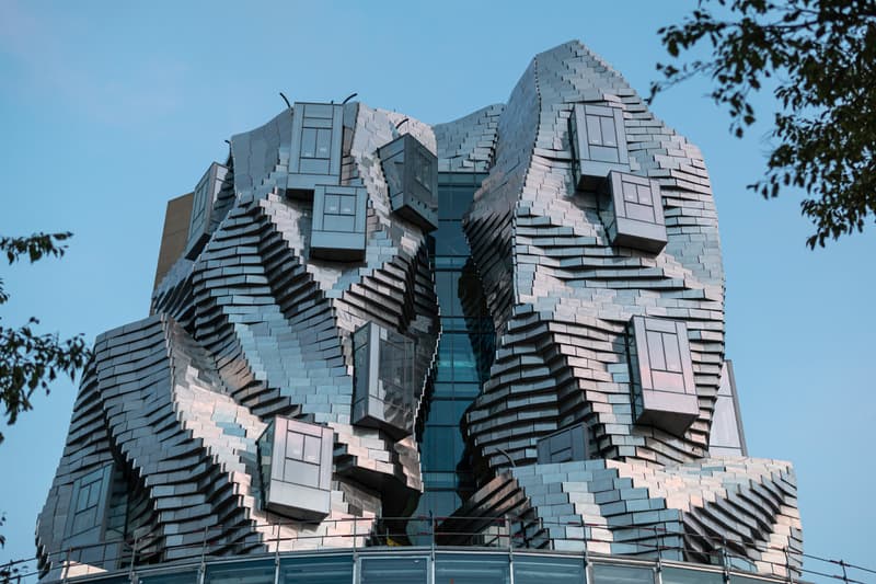 Frank Gehry Unveils Reflective Stainless Steel-Clad Tower in Southern France LUMA Arles france parc des ateliers paris van goh starry night roman amphitheater aluminum france roman arles south of france