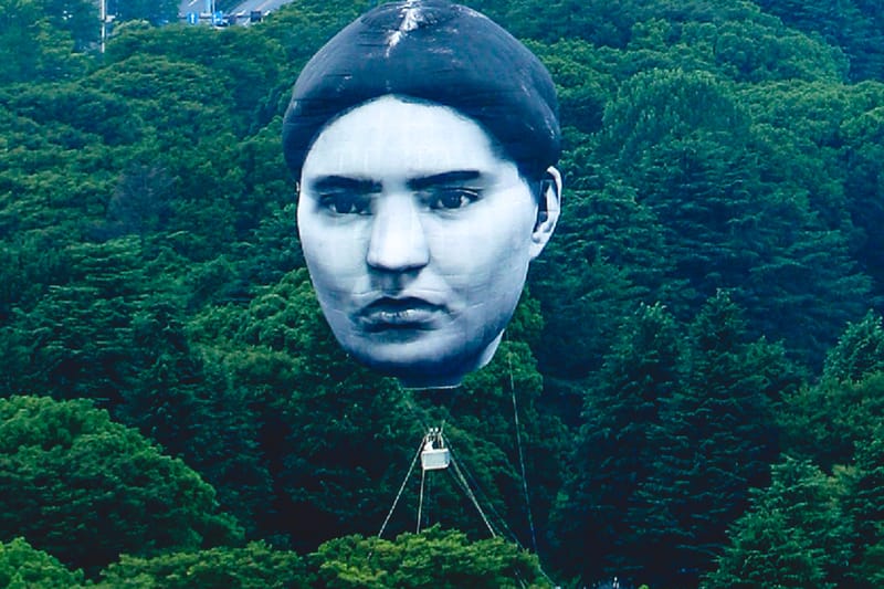 Giant Human Head Balloon Hovering Over Tokyo's Skyline Stuns Citizens