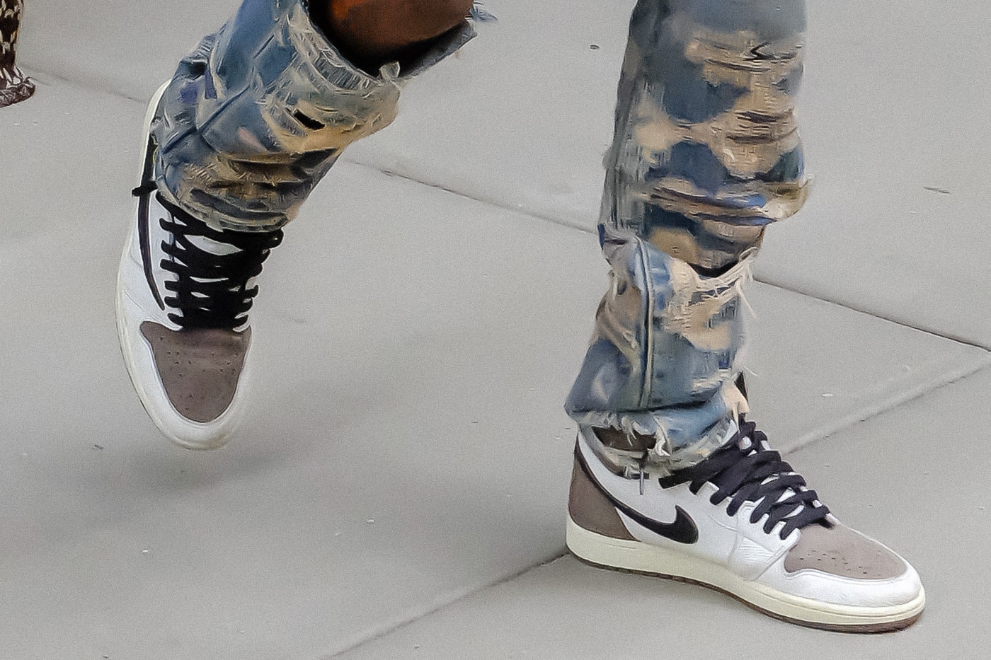 Travis Scott Spotted in Reverse Air Jordan 1 High Collab Again