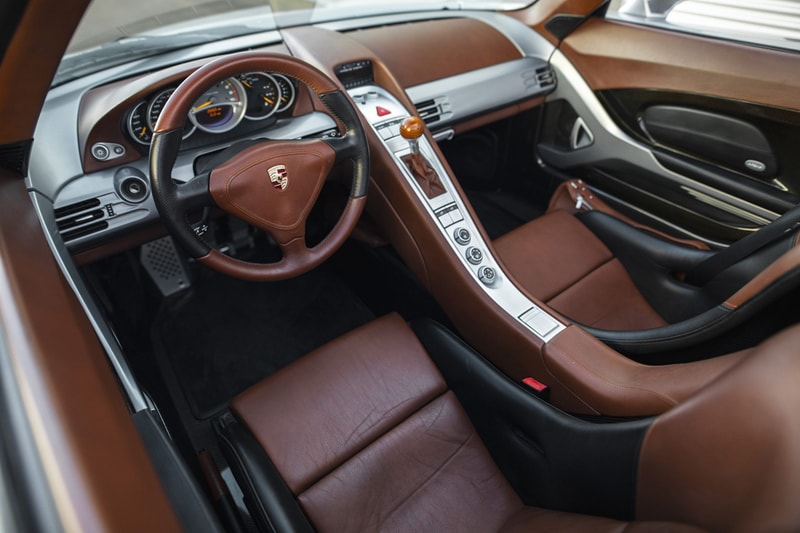 2004 Porsche Carrera GT V10 Silver Metallic Brown Leather Bring a Trailer Auction $1.3M USD For Sale Rare German Supercar Modern Classic