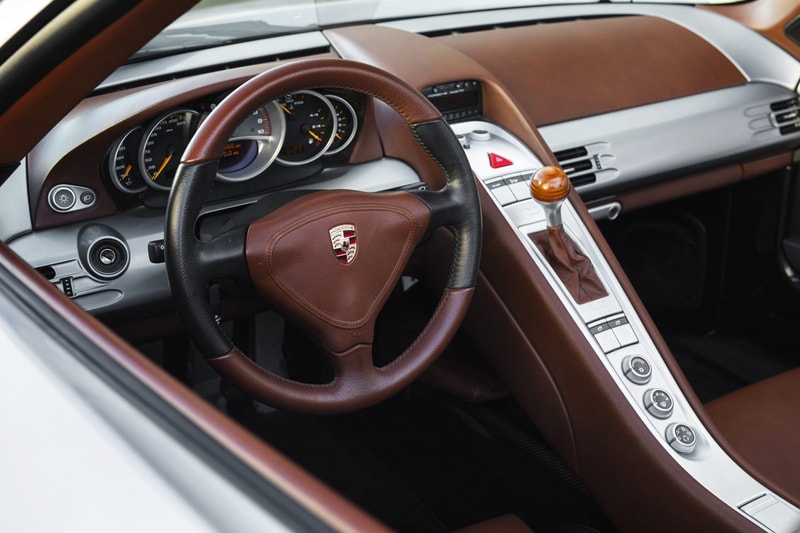 2004 Porsche Carrera GT V10 Silver Metallic Brown Leather Bring a Trailer Auction $1.3M USD For Sale Rare German Supercar Modern Classic