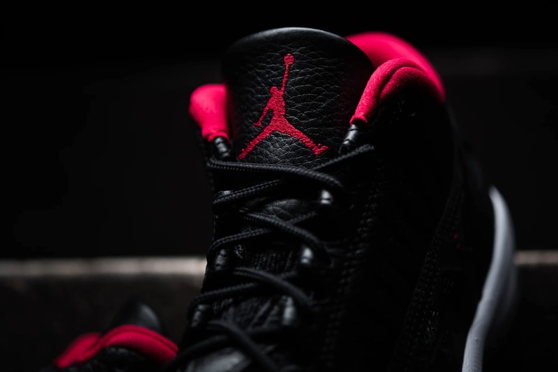 air michael jordan brand 11 low ie bred black red white 919712 023 official release date info photos price store list buying guide