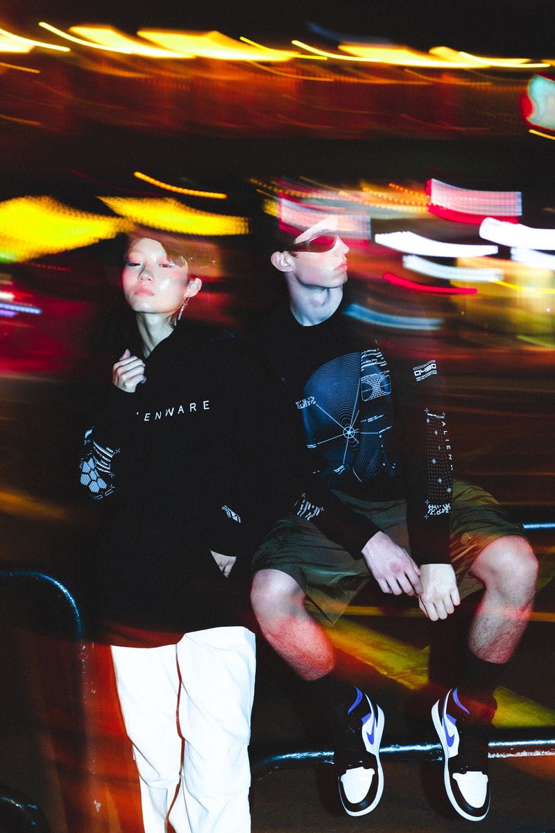 Alienware HBX lookbook shots merch debut graphics design First Contact concept assortment selection of t-shirts, long sleeves, hoodies and hats postmodern aesthetic scanned topographical Alienware head reflective logos, laptop exploding holographic effects, custom typefaces and fonts, internal molecular structure vessels along  the sleeves and Alienware Circuit Head graphics with Chrome Glow cyber blue + grey and neon green + purple washed grey olive 2 color print coordinates and dimensional structures neon green, bright orange and purple Alienware's mapping effects, technical-wear focus and radar monitors hoodie neon green space grey digital gateway black electric blue hat made in the USA with premium Flexfit tech material