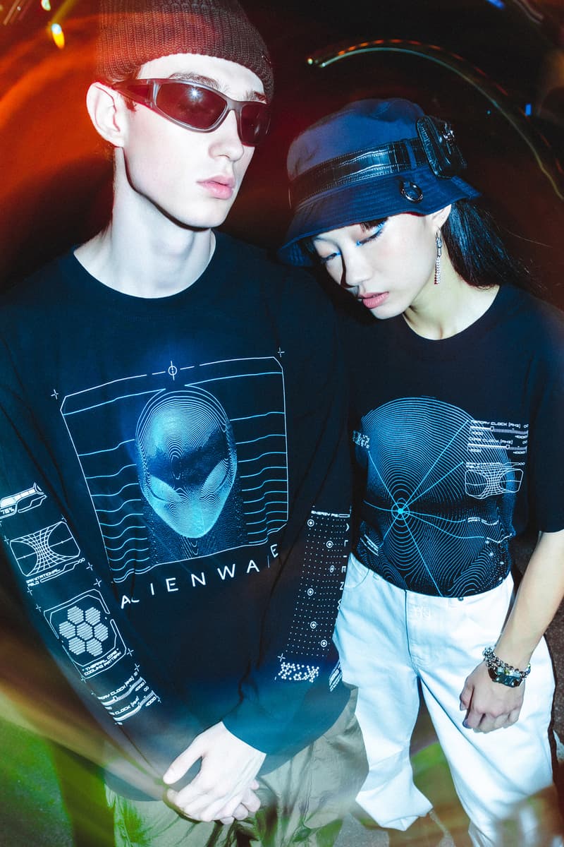 Alienware HBX lookbook shots merch debut graphics design First Contact concept assortment selection of t-shirts, long sleeves, hoodies and hats postmodern aesthetic scanned topographical Alienware head reflective logos, laptop exploding holographic effects, custom typefaces and fonts, internal molecular structure vessels along  the sleeves and Alienware Circuit Head graphics with Chrome Glow cyber blue + grey and neon green + purple washed grey olive 2 color print coordinates and dimensional structures neon green, bright orange and purple Alienware's mapping effects, technical-wear focus and radar monitors hoodie neon green space grey digital gateway black electric blue hat made in the USA with premium Flexfit tech material