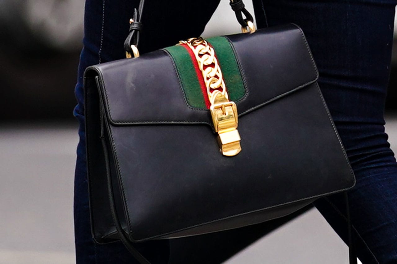 Woman carrying a big Gucci bag | Gucci bag, Women handbags, Bags