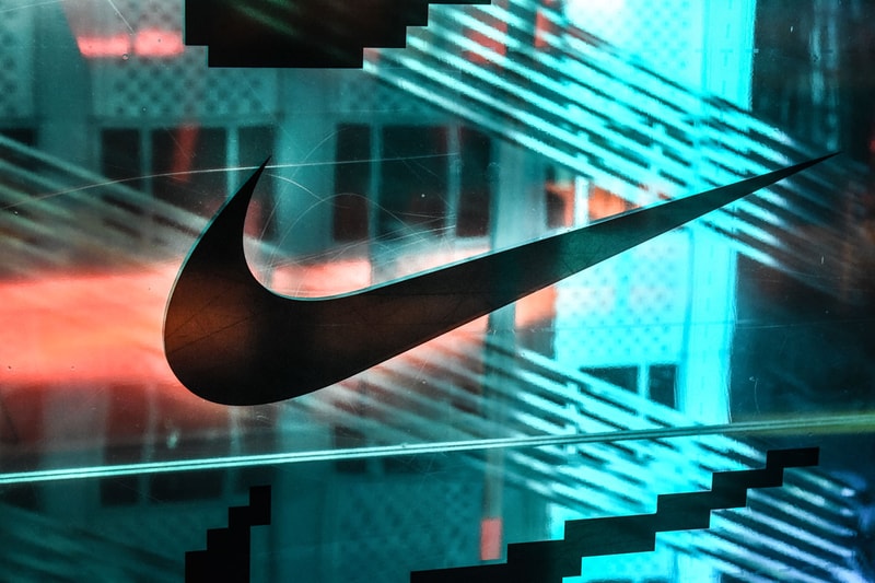 In this photo illustration, a Nike Inc. logo seen displayed on a