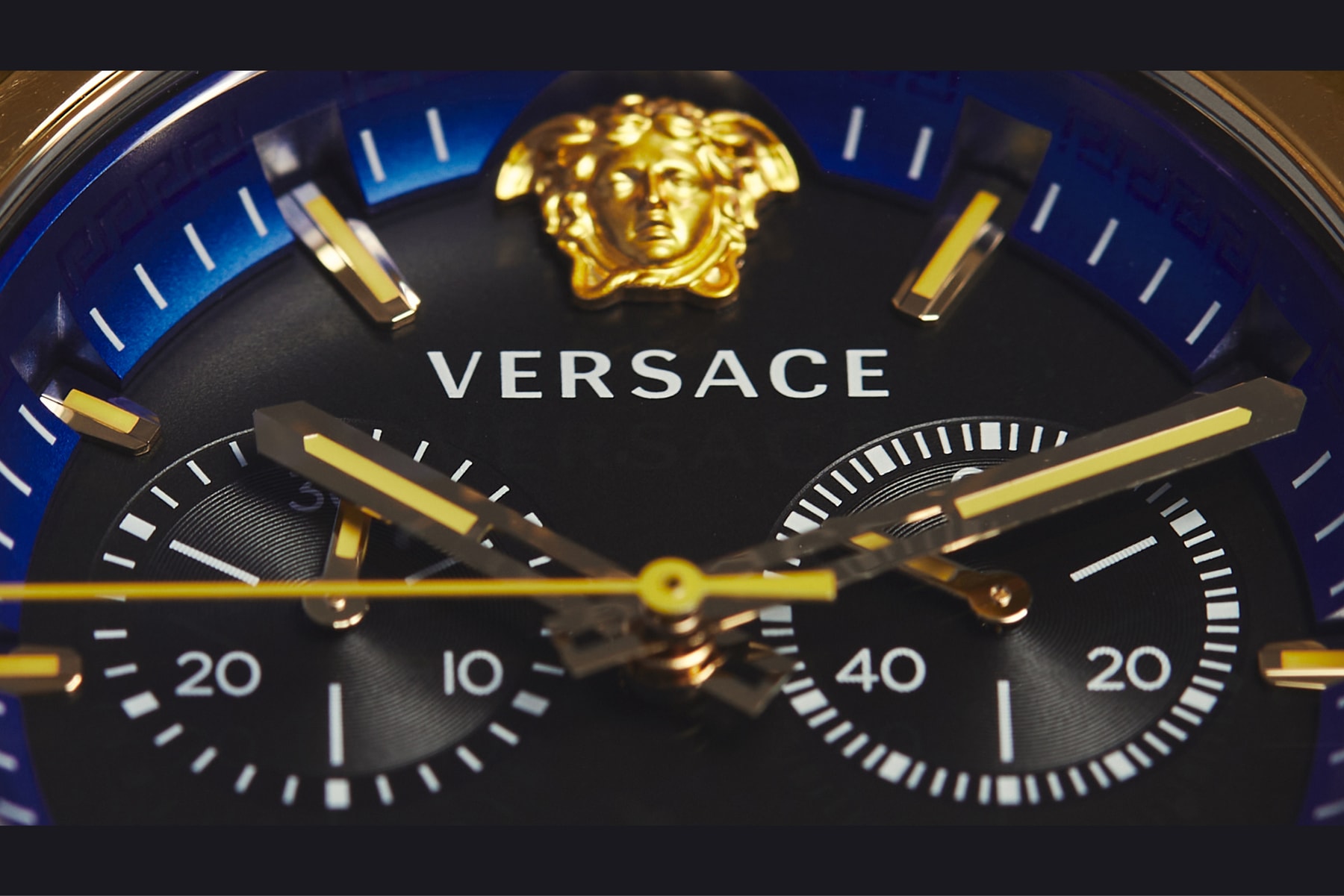 versace Donatella Versace avant garde classic designs, sophisticated functionalities, richer details and flawless personal style all-new Versace Icon Active chronograph watch street culture references and a sporty, minimalistic design Greek key metal loop Medusa that sits at 12h Greek key Greca motif inner ring IP champagne transparent polycarbonate opulent