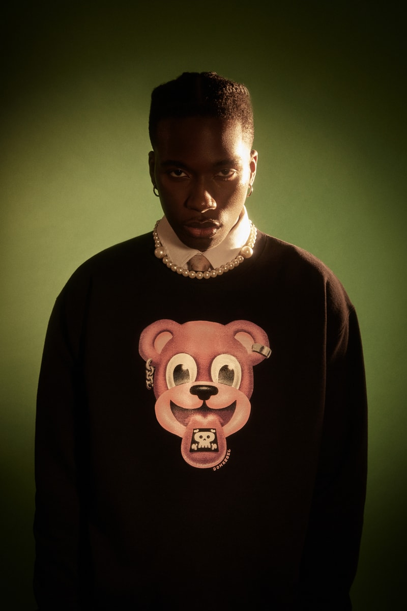 DOMREBEL art studio Montréal, Canada DIY aesthetic with high quality fabrics and savoir-faire cartoon characters high quality screen-prints, embroideries and paintings on range of boxy tees, heavyweight sweats, trackpants and denim french terry cotton custom hand-set Swarovski crystals or distressed holes second launch january 2022