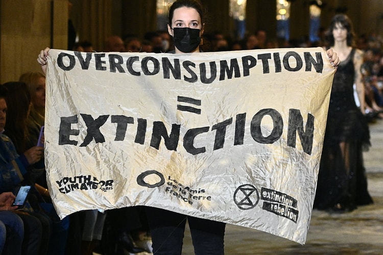 Protestor Crashes Louis Vuitton SS22 Runway at Paris Fashion Week