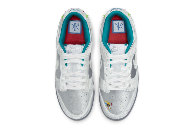 First Look at the Nike Dunk Low "Ice" Holiday Season Harbin international sculpture festival silver satin white velvet turqoise pennon banners children sled SNKRS release info