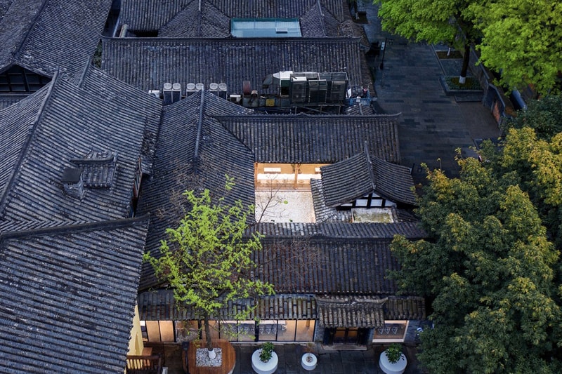B.L.U.E. Architecture Studio Concept Cafe % Arabica Dezeen Kuan Alley Zhai Alley Jing Alley Kuanzhai Alley Water Courtyard Stones Social Gathering Architecture