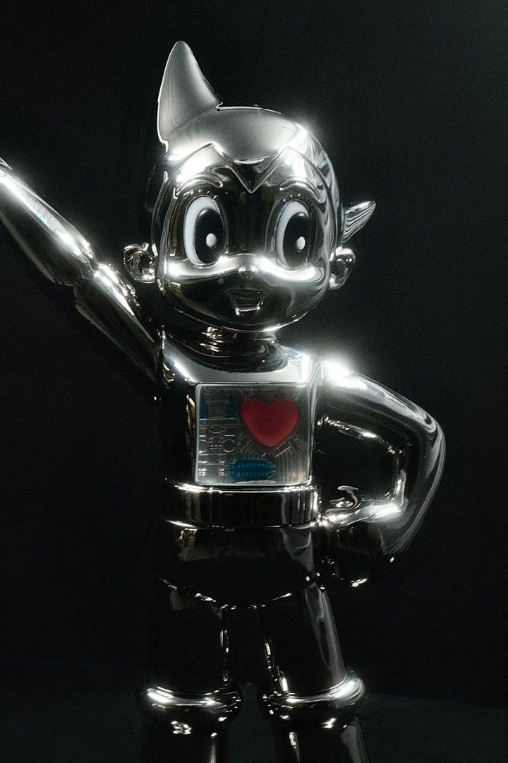 YOON First Look AMBUSH Astro Boy Figure jumpsuit silver metallic open heart black circuitry release info
