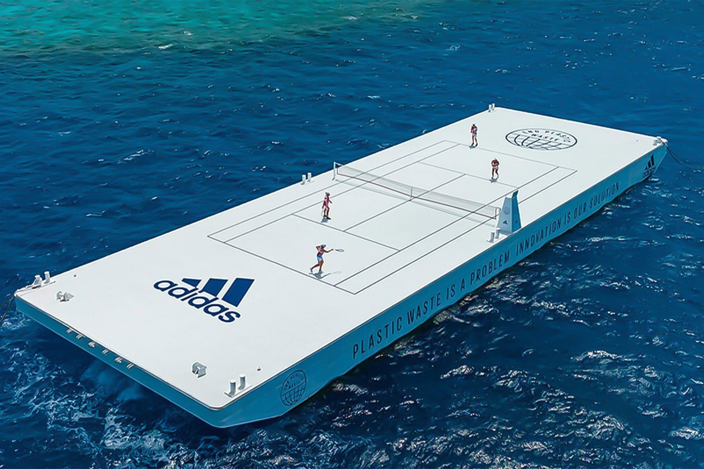 Parley and adidas Float Recycled Tennis Court On Australia's Great Barrier Reef plastic waste bottles eco climate pledge awareness apparel floating barge white navy images news