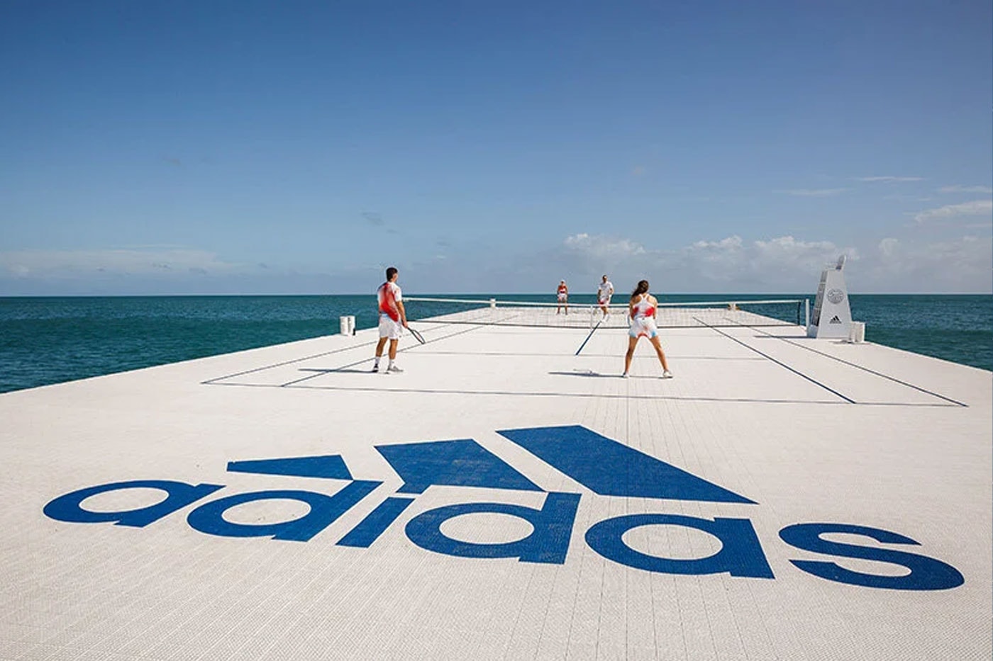 Parley and adidas Float Recycled Tennis Court On Australia's Great Barrier Reef plastic waste bottles eco climate pledge awareness apparel floating barge white navy images news