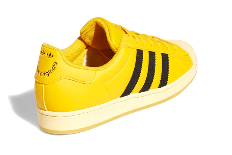 yellow adidas superstar