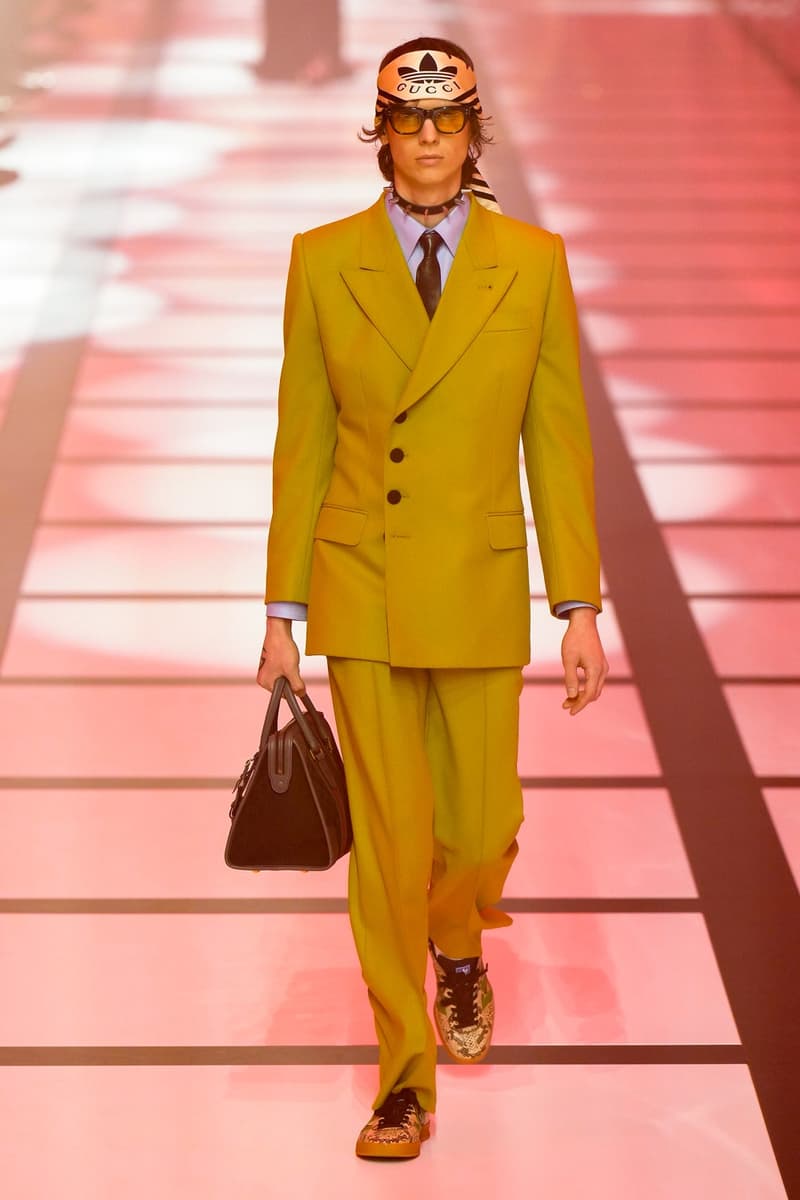 Gucci x adidas Unveils Fall 2022 Collection Blazers Jackets Pants Knitwear Latex Trefoil Three Strips Midi Dresses Leather Skirts Corduroy Chiffon Sportswear German Label Luxury Fashion Lookbook Plaid Monogram Pinstripe Patterns Peak Wide Lapel Hats Accessories Blue Yellow  