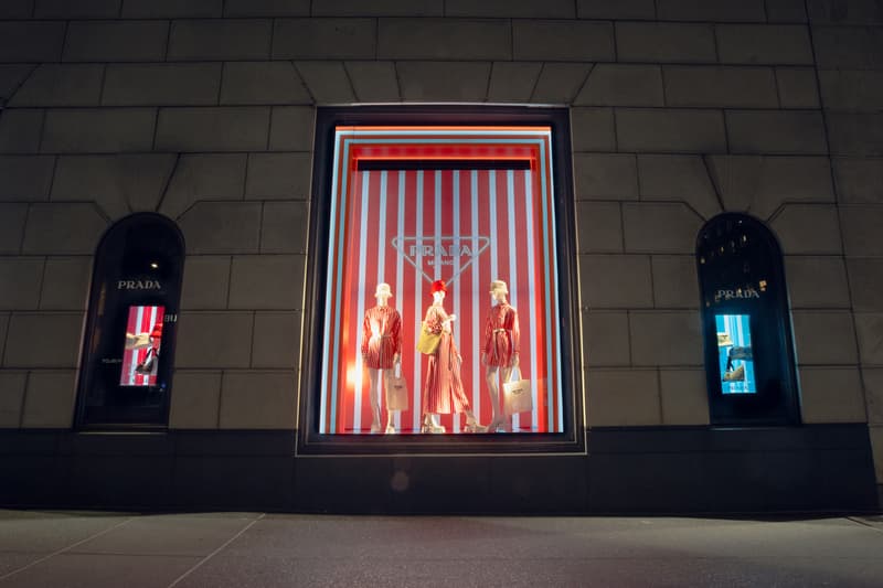 Spring Summer 2022 Collection Prada Tropico Hypnotic Window Light Installation Bergdorf Goodman Department Store Refracted Multicolored Lights Luxury Fashion Experiential Storefront Vertical Diagonal Lines Hues Green Orange Red Bright Vivid Nylon Striped Dresses Blouses Shoes Rubber Sandals Bucket Hats Raffia Handbags Pajama Sets Tropical Rainbow 