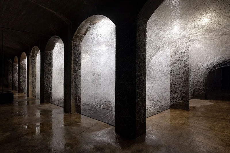 Chiharu Shiota copenhagen former water reservoir exhibition cisternerne frederiksberg museums 1000 sqm multiple realities labyrinth caverns water dresses weave thread news