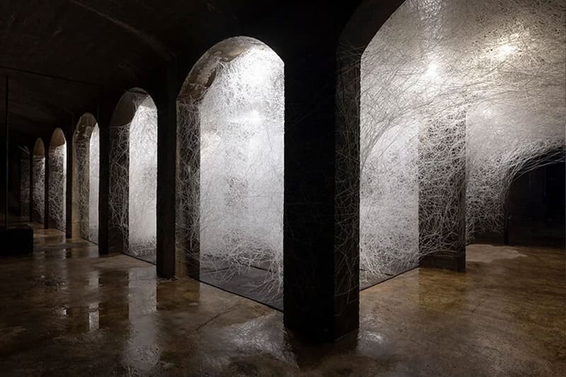 Chiharu Shiota copenhagen former water reservoir exhibition cisternerne frederiksberg museums 1000 sqm multiple realities labyrinth caverns water dresses weave thread news