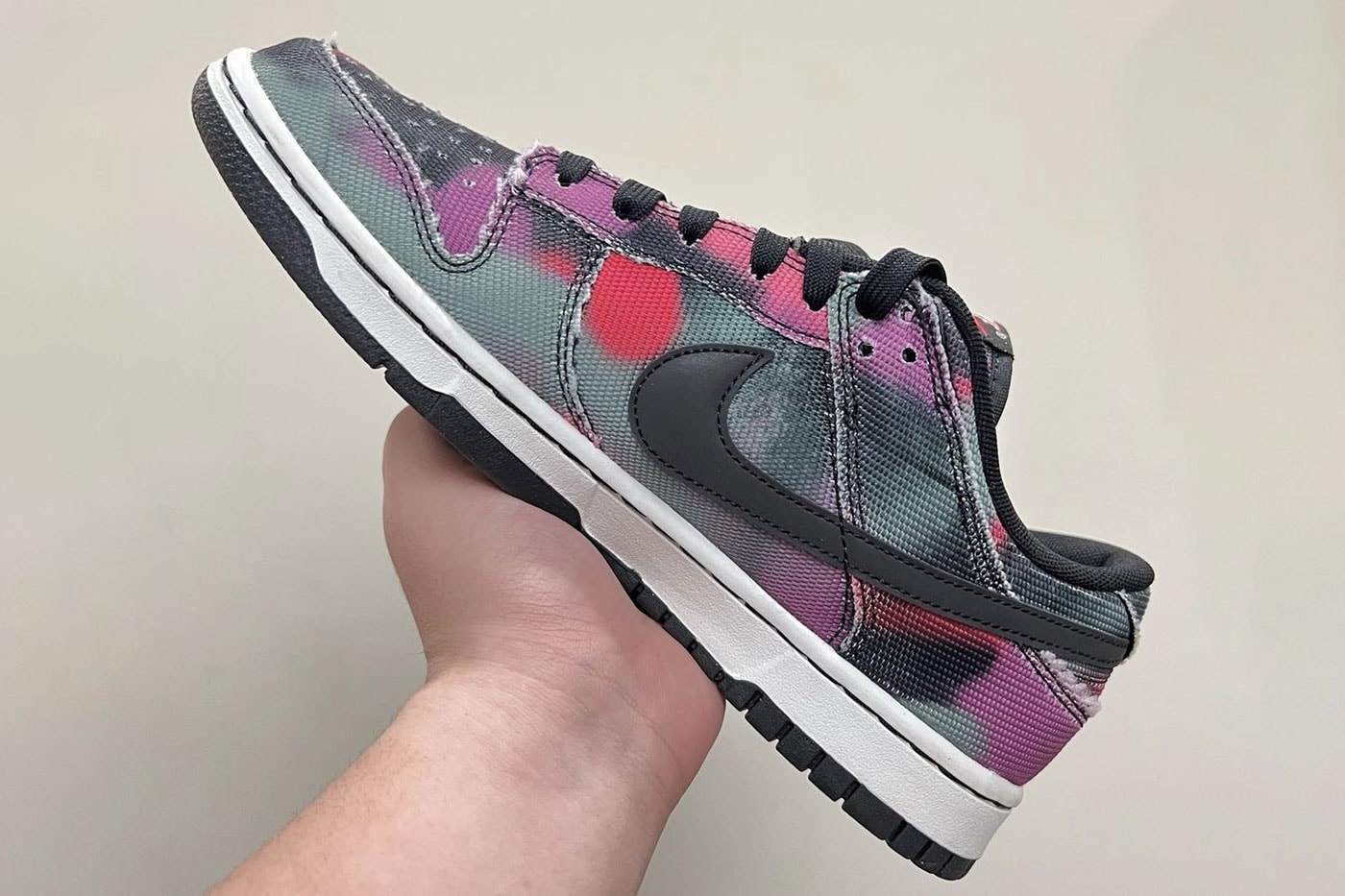 Nike Dunk Low Graffiti swoosh red pink purple black white gray green frayed edge graphics release info first look images