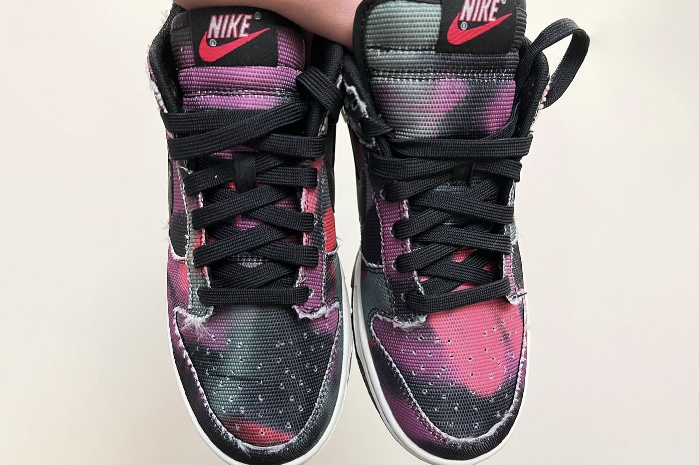 Nike Dunk Low Graffiti swoosh red pink purple black white gray green frayed edge graphics release info first look images