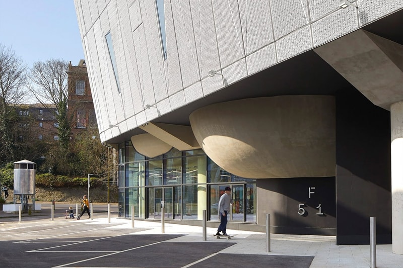 Hollaway Studio Designs the World's First Multi Floor Skatepark climbing wall three stories adrenaline building boxing gym cafe space central hub for youth 