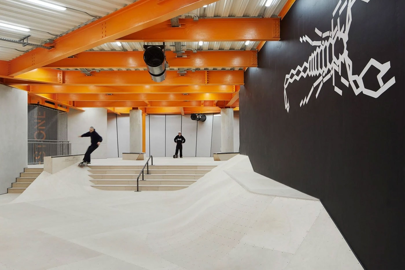 Hollaway Studio Designs the World's First Multi Floor Skatepark climbing wall three stories adrenaline building boxing gym cafe space central hub for youth 