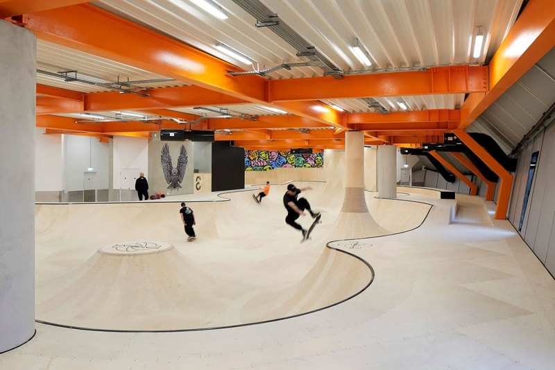 Hollaway Studio Designs the World's First Multi Floor Skatepark climbing wall three stories adrenaline building boxing gym cafe space central hub for youth 