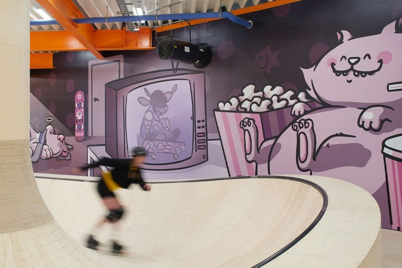 Hollaway Studio Designs the World's First Multi Floor Skatepark climbing wall three stories adrenaline building boxing gym cafe space central hub for youth 