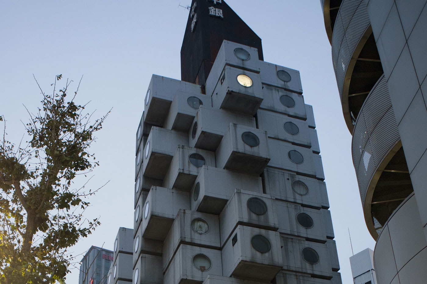 Japan Tokyo contemporary architecture nakagin capsule tower futuristic vision urban living porthole metabolism plugged april 12 unesco 
