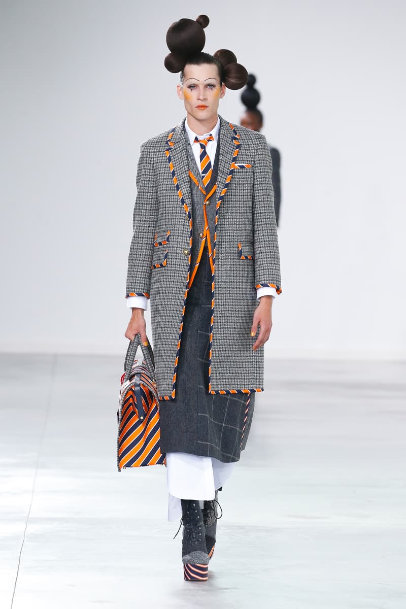 Thom Browne Brings the Drama to Classic Tailoring for Fall 2022 nyc new york city pleated skirts blazers toys chairbear adult toy shop teddybears 