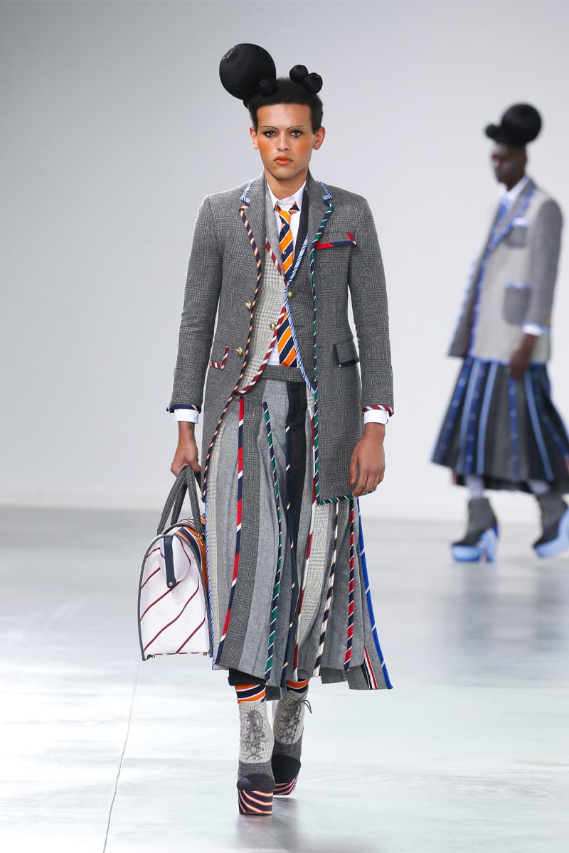 Thom Browne Brings the Drama to Classic Tailoring for Fall 2022 nyc new york city pleated skirts blazers toys chairbear adult toy shop teddybears 