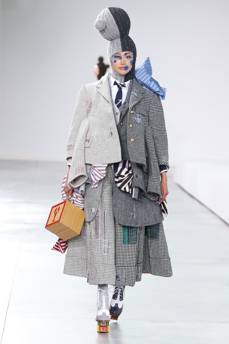 Thom Browne Brings the Drama to Classic Tailoring for Fall 2022 nyc new york city pleated skirts blazers toys chairbear adult toy shop teddybears 