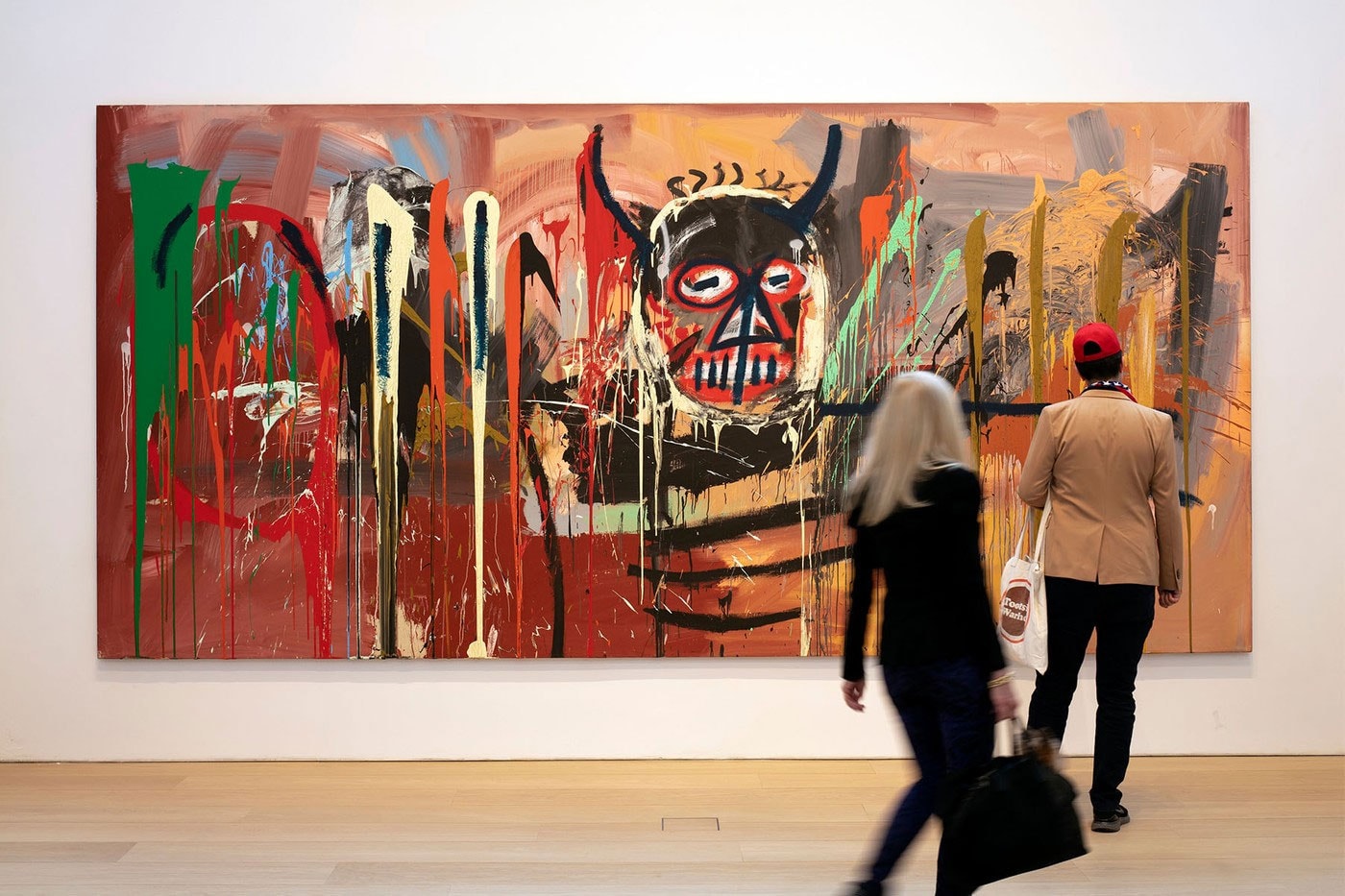 Jean michel basquiat untitled 1982 painting sells for 85 million usd phillips auction 70 million estimate horned devil acrylic spray paint canvas  third highest price paid taiwan news