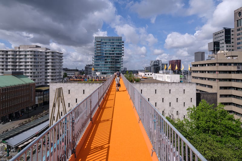 MVRDV Installs Orange Rooftop Walkway Across Rotterdam