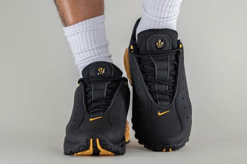 On-Foot Look at the NOCTA x Nike Hot Step Air Terra "Black/University Gold" DH4692-002 drake nike nocta purple the6ix