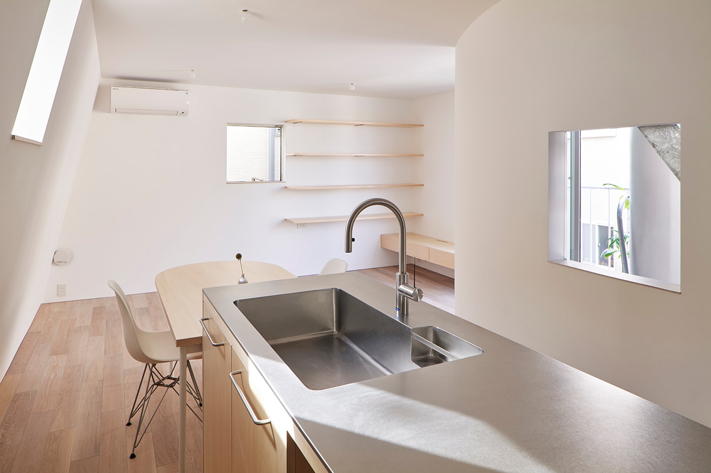 NOT Architects Studio "Scoops Up" Surrounding Scenery for Skinny Tokyo House