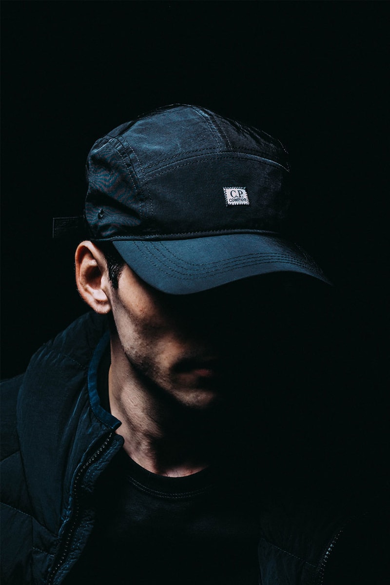 C.P. Company Fall/ Winter 2022 Collection HBX Release Info Buy Price Hooded Down Jacket Shirt Pockets Shorts Cargo Pants Fleece Nylon Crossbody Packs Shoulder Bags Rucksack Beanie Logo Caps Hoodie Brown Black Green Blue Navy