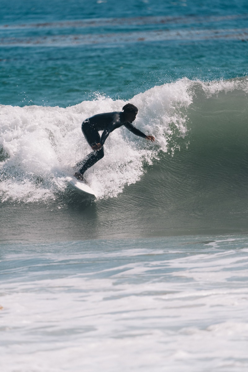 celine homme beach surf board ride black surfer malibu ocean water surfing morning ride black white french chic