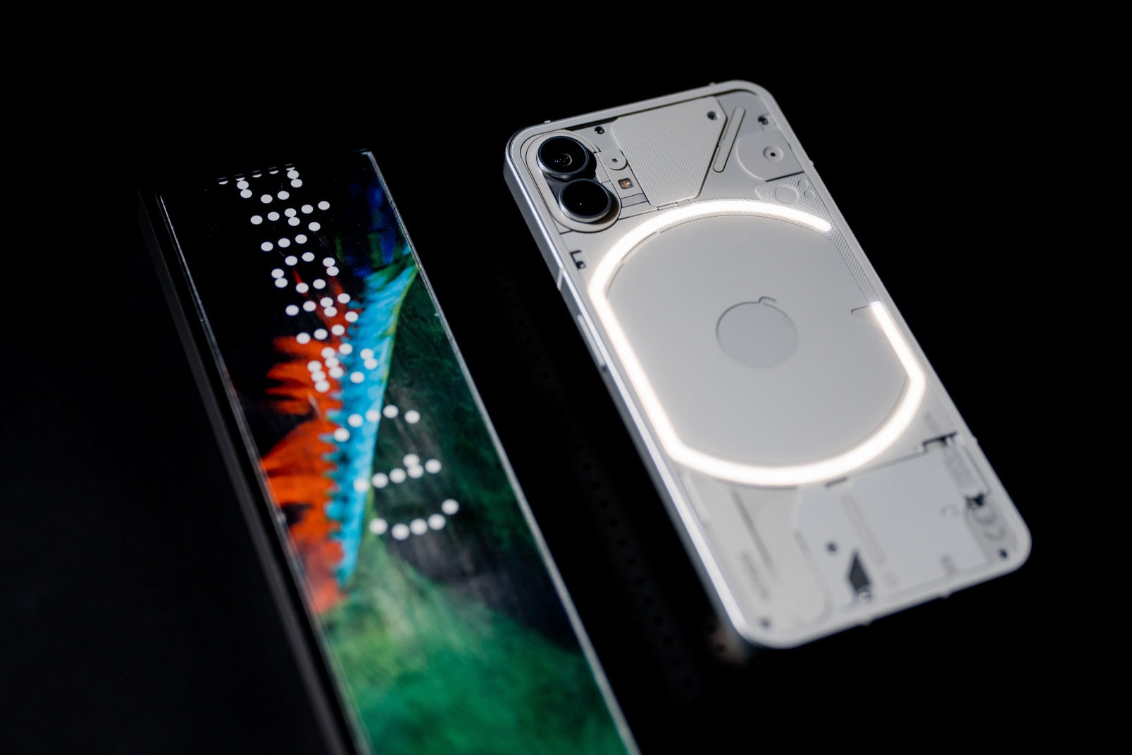 Nothing Phone 1  iphone x dual camera wireless charging coil carl pei Qualcomm Snapdragon skeleton android adam bates 2022 release info date price