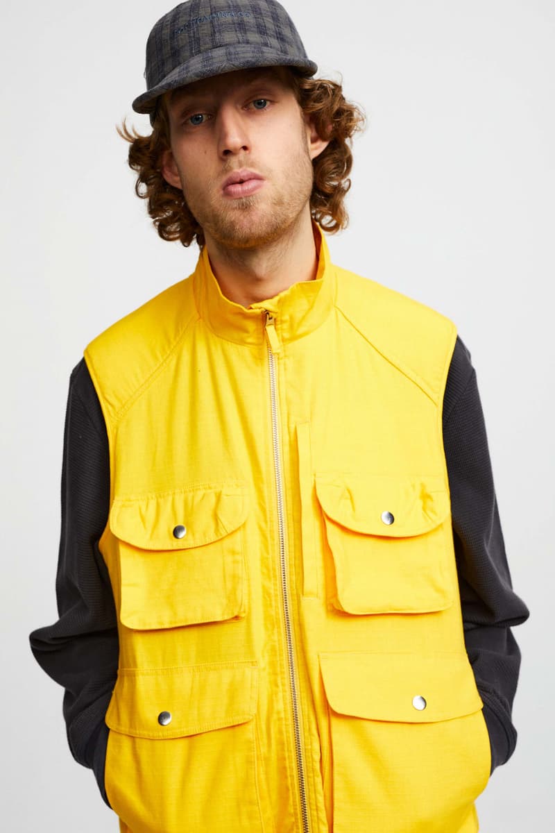 Pop Trading Company Debuts AW22 Collection tshirts jackets vests long sleeves pants hats white blue yellow orange grey black tan