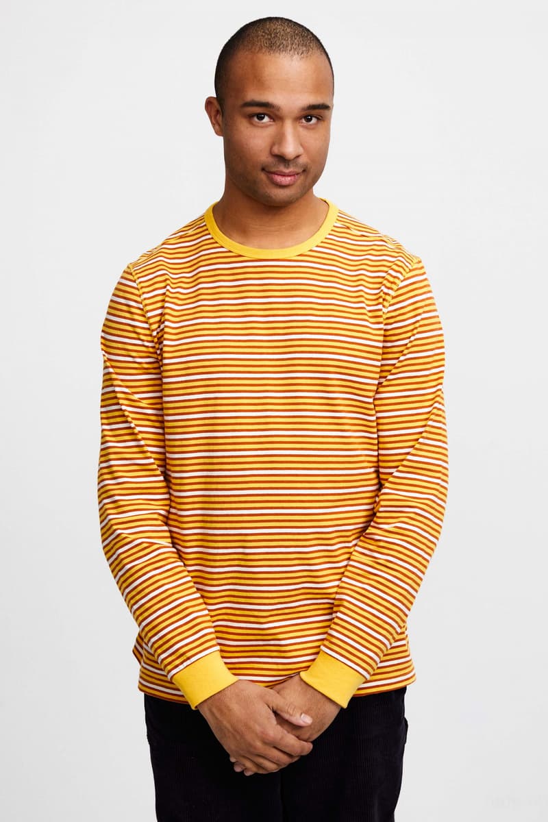 Pop Trading Company Debuts AW22 Collection tshirts jackets vests long sleeves pants hats white blue yellow orange grey black tan