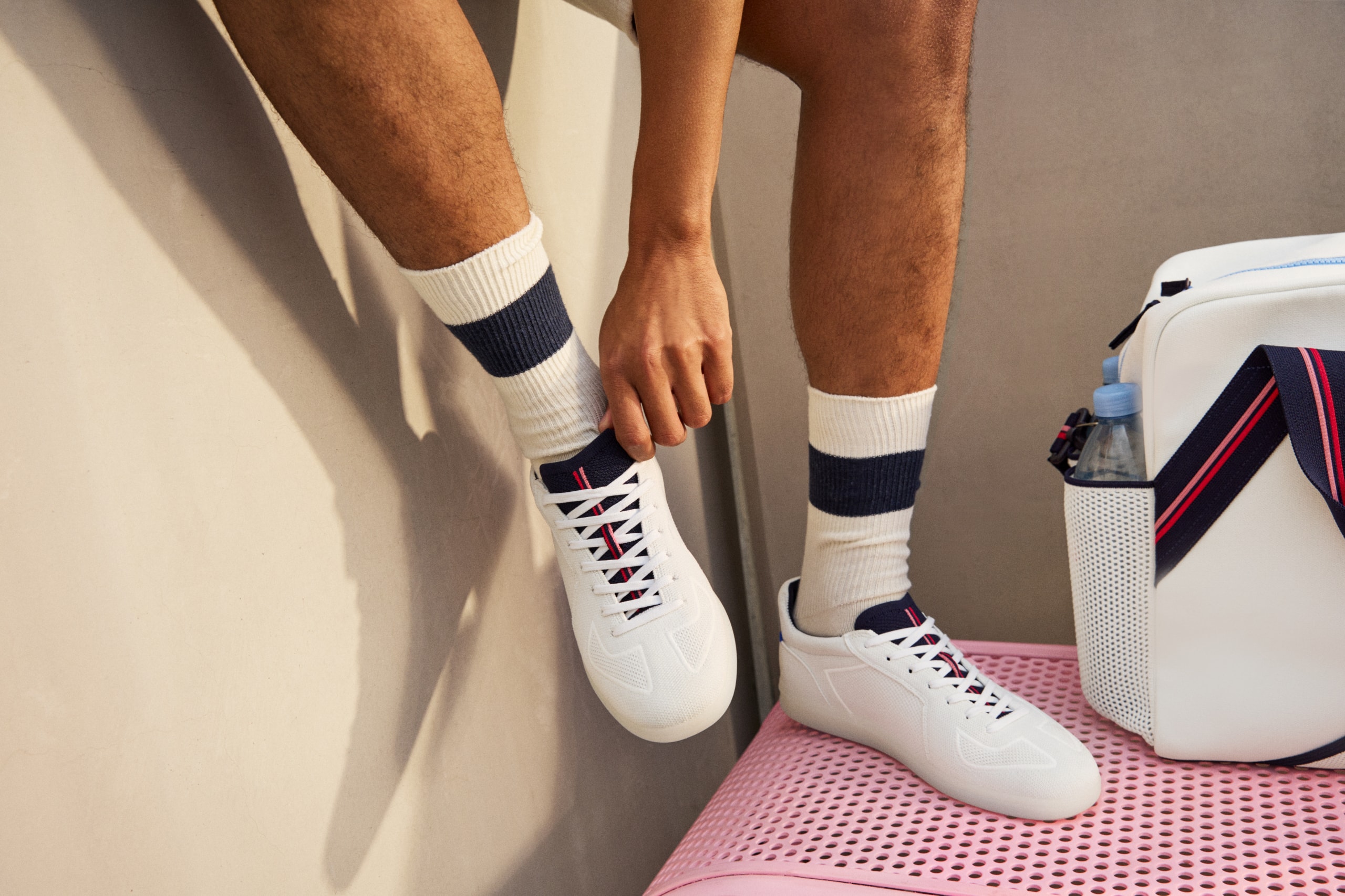 Rothy’s and evian® Water Debut Tennis-Inspired Collection Made With 72,000 Water Bottles hats visiors duffle bags sneakers slip-ons racket bags white red blue