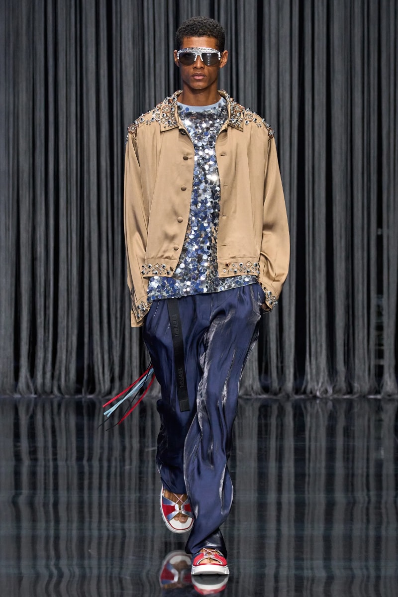 Ferrari Takes a Third Victory Lap Around the Fashion Circuit With SS23 Collection spring/summer 2023 milan fashion week race car teatro lirico juventus italian lvmh rocco iannone
