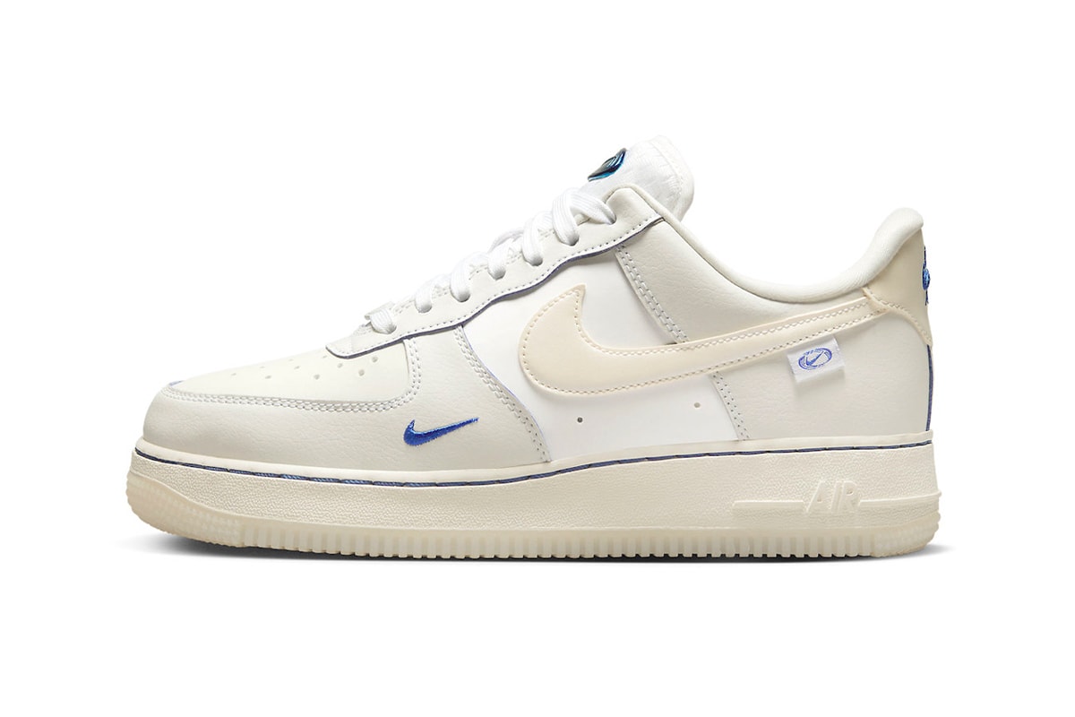 This Nike Air Force 1 Low Is Dressed in a Sail Colorway and Detailed With Blue Metallic sneakers low-top swoosh sneakers transluscent global motifs