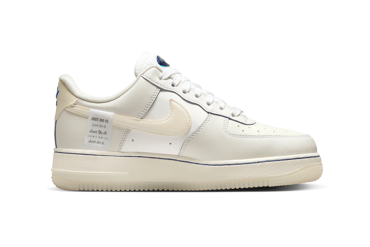 This Nike Air Force 1 Low Is Dressed in a Sail Colorway and Detailed With Blue Metallic sneakers low-top swoosh sneakers transluscent global motifs